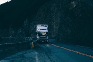Diesel Semi Truck Moving Shipment Across Interstate